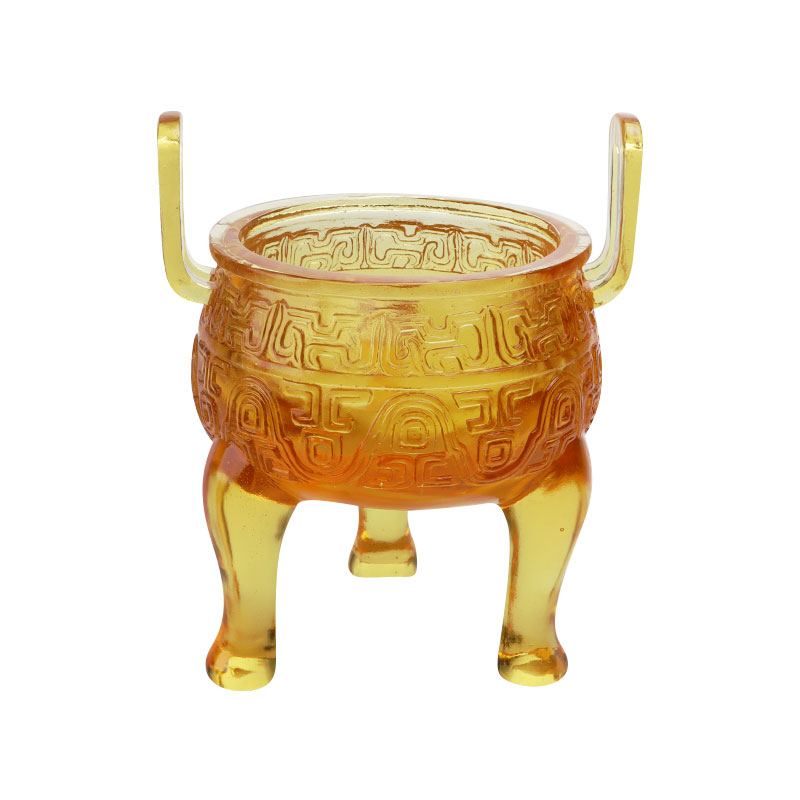 Kullanvärisiä lasitejalustan koristeita