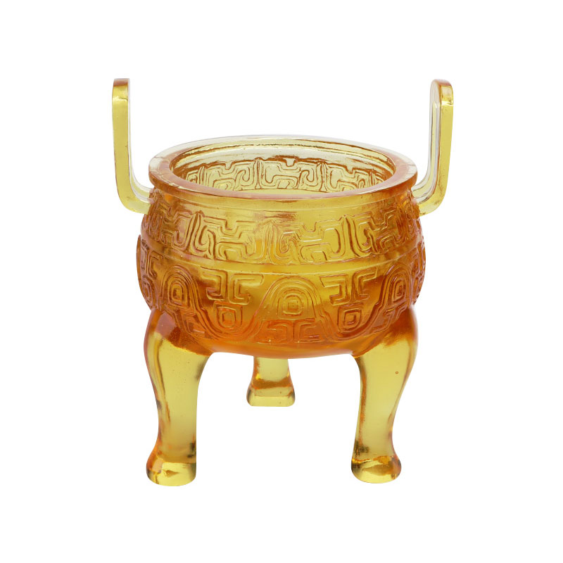 Kullanvärisiä lasitejalustan koristeita